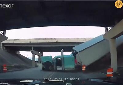 (ویدئو) لحظه سقوط یک تریلی از بزرگراه