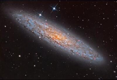 تصویر روز ناسا: NGC 253 کهکشان غبارآلود