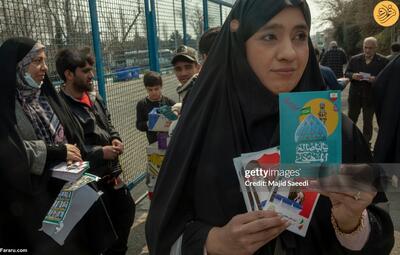 (تصاویر) توزیع عکس‌های نامزد‌های انتخابات مجلس در تهران