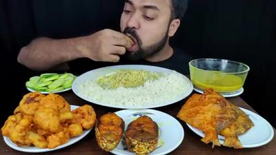 (ویدئو) غذا خوردن با صدا؛ خوردن جالب 2.3 کیلو چلو ماهی توسط جوان بنگلادشی
