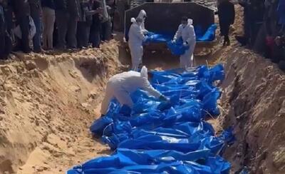 دفن دسته جمعی پیکرهای ۴۷ شهید فلسطینی در غزه+ فیلم