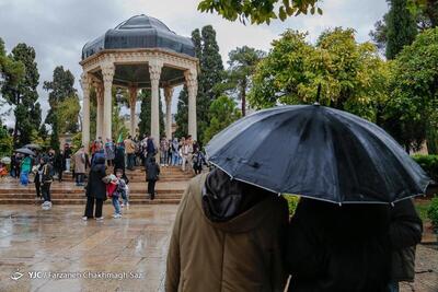 (تصاویر) بارش رحمت الهی بر سر مهمانان نوروزی در شیراز