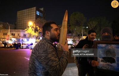 عکس/بوسه‌ای بر گلوله؛ عکس جوان ایرانی پربازدید شد | اقتصاد24