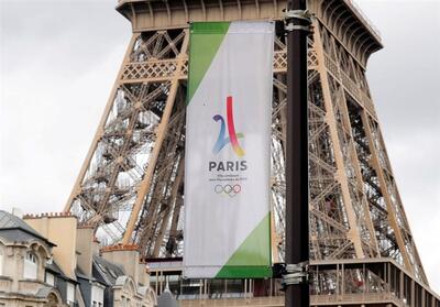 روشن شدن مشعل المپیک 2024 توسط شناگر فرانسوی - تسنیم
