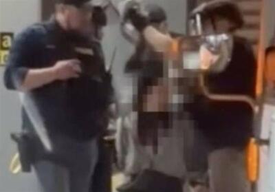 توسل پلیس آمریکا به زور برای برداشتن حجاب زن مسلمان - تسنیم