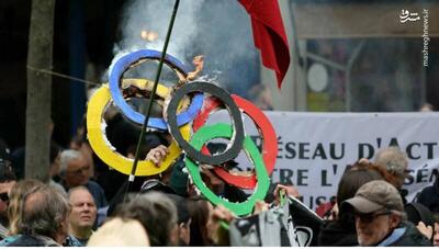 کارگران معترض در پاریس حلقه‌های المپیک را آتش زدند!+ تصاویر