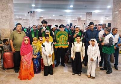 ورود خادمان رضوی با پرچم متبرک آستان قدس به خوزستان - تسنیم