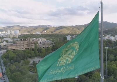 اهتزاز پرچم مزین به نام امام الرضا(ع) در همدان+ فیلم - تسنیم