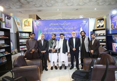 بازدید هیئت طالبان از موسسه طبع و نشر قرآن و نمایشگاه کتاب - تسنیم