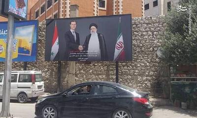 تصاویر رئیس‌جمهور شهید ایران و بشار اسد در خیابان‌های دمشق