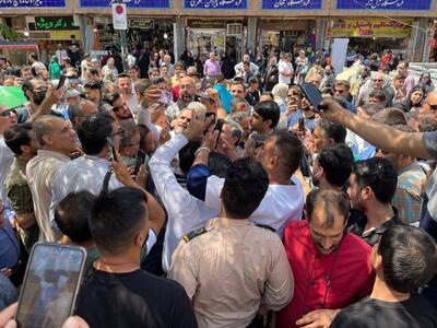 تصویری غیرمنتظره از احمدی‌نژاد در بازار تهران