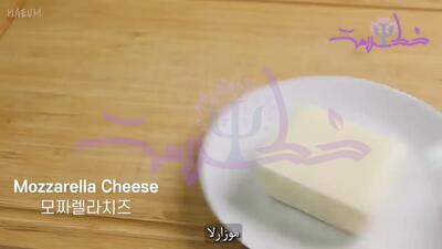 فیلم/ طرز تهیه متفاوت نان سیر پنیری با عطر جعفری