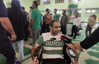 حضور با ویلچر در محل اخذ رای در مسجد توحید بوشهر