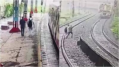 لحظه دلخراش خودکشی پدر و پسر هندی روی ریل قطار (فیلم)