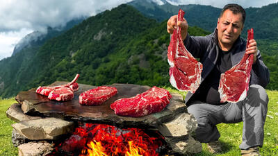 (ویدئو) روش دیدنی آشپز آذربایجانی برای پخت متفاوت گوشت گاو روی سنگ داغ!
