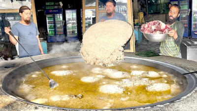 (ویدئو) غذای خیابانی در پاکستان؛ پخت 210 کیلوگرم کابلی پلو با گوشت
